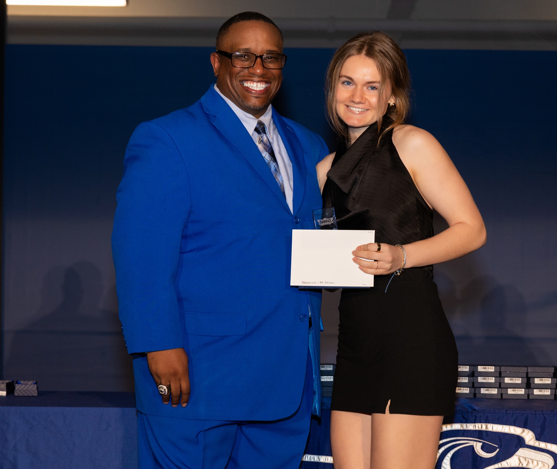 Harper Athletics' Female Athlete of the Year Grace Nikolakakis stands with Dr. Cedric Brown