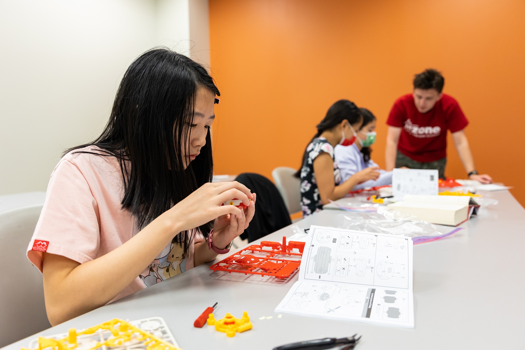 An InZone camper works on a STEM activity