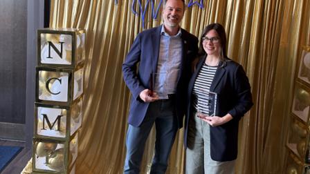 Jeff Julian and Julie DeMarco hold their NCMPR awards