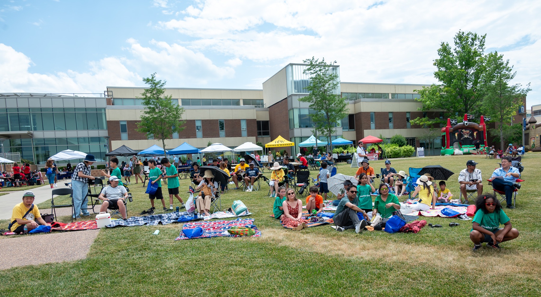 Juneteenth in the Burbs A crowd enjoys outdoor activities at Juneteenth in the Burbs