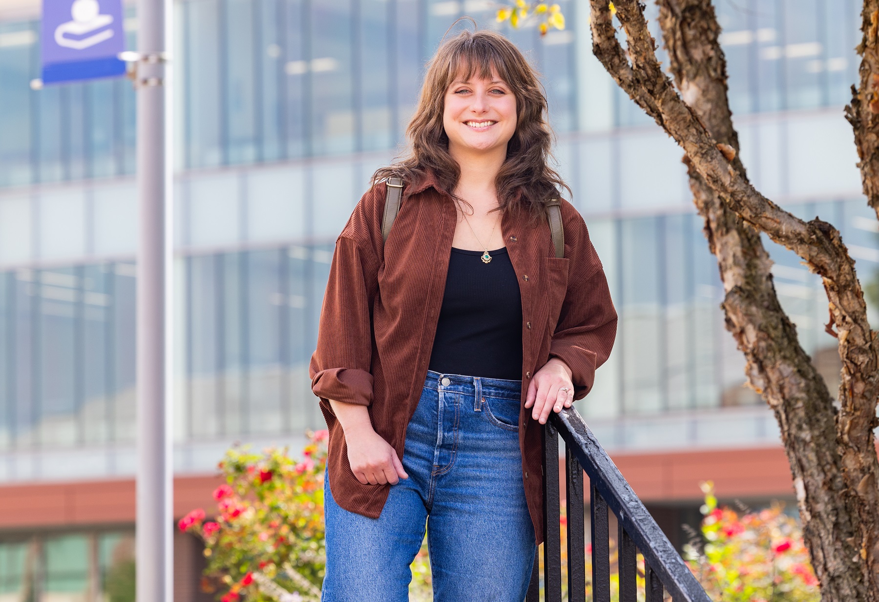 Kate Guerrero, who won a statewide author contest, stands on the Harper College campus.