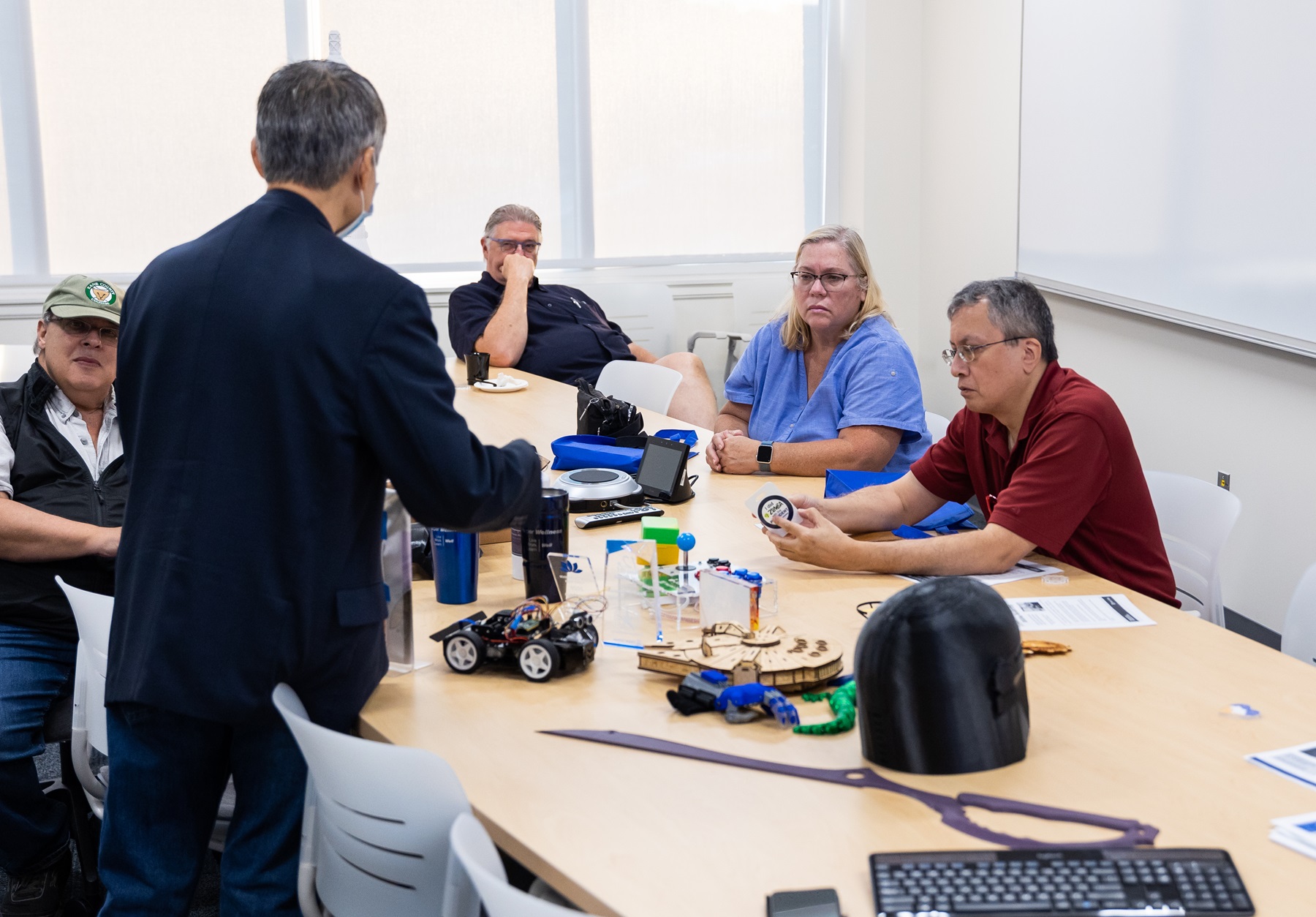 LLI instructor engages with older adult students