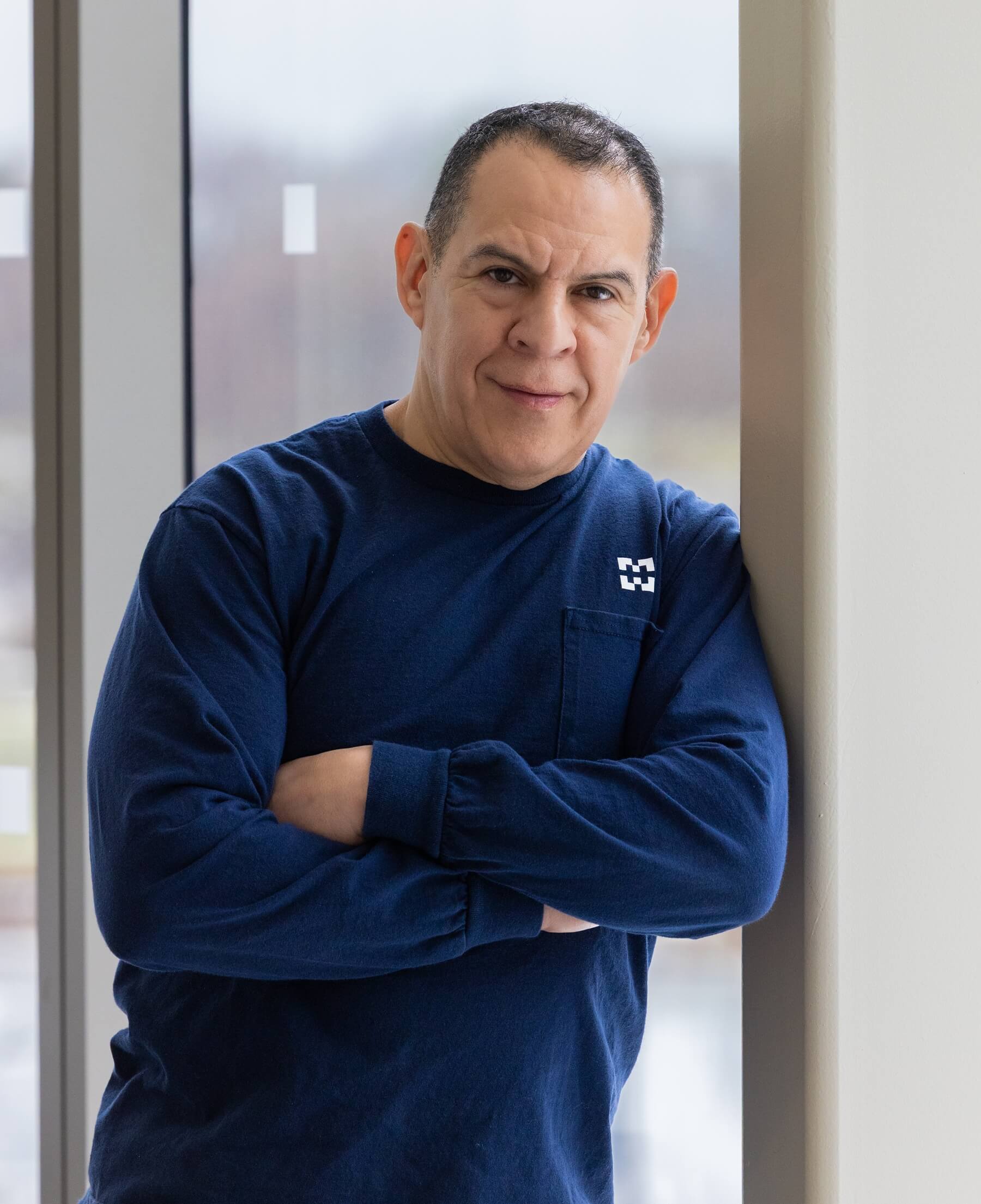 Harper employee Sammy Gomez stands in Building D