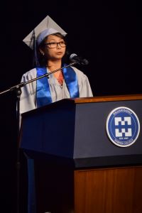 Marie Bollozos addresses her fellow graduates