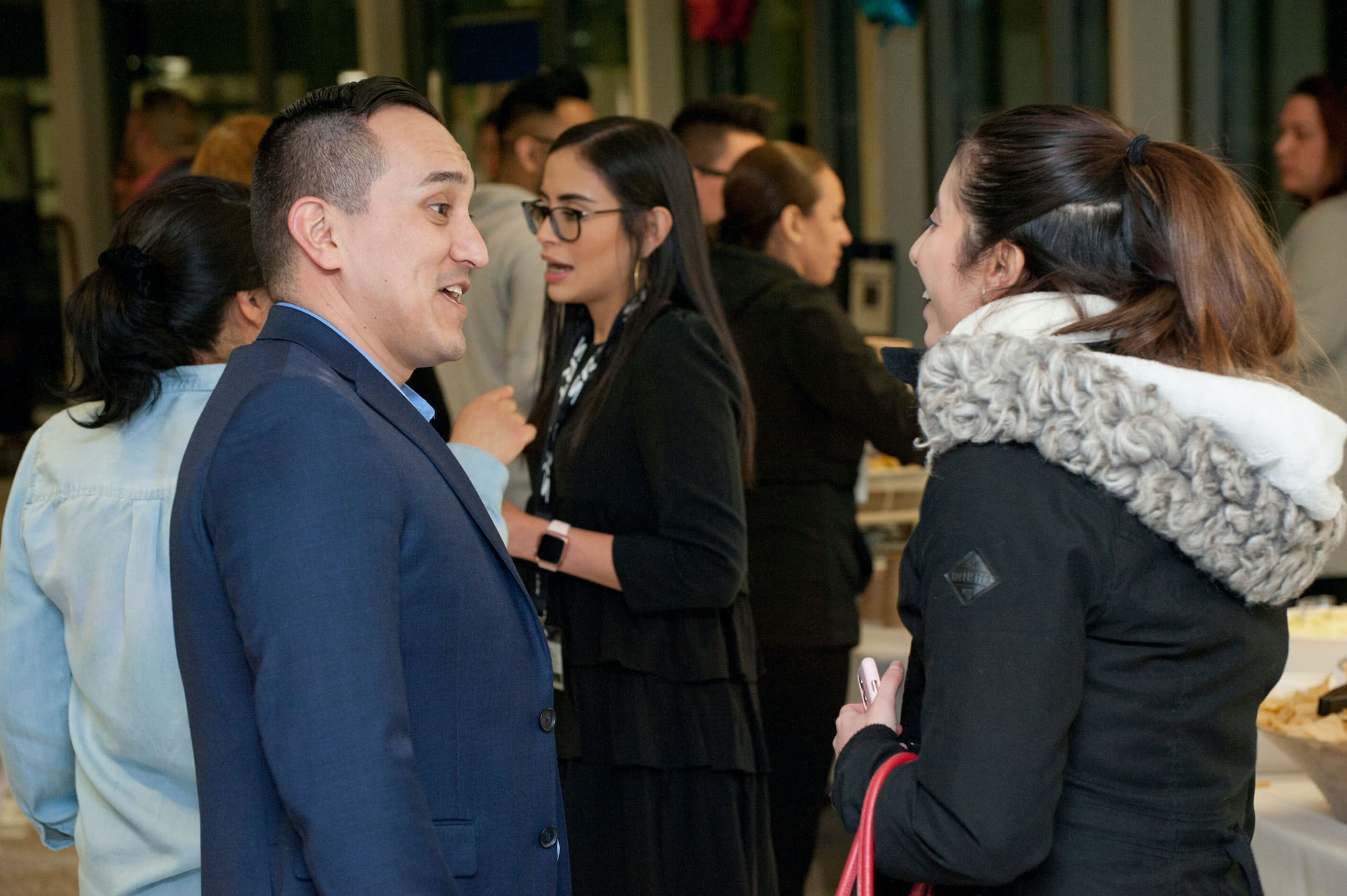 Alejandro Mendoza speaks to a student at a PASO event