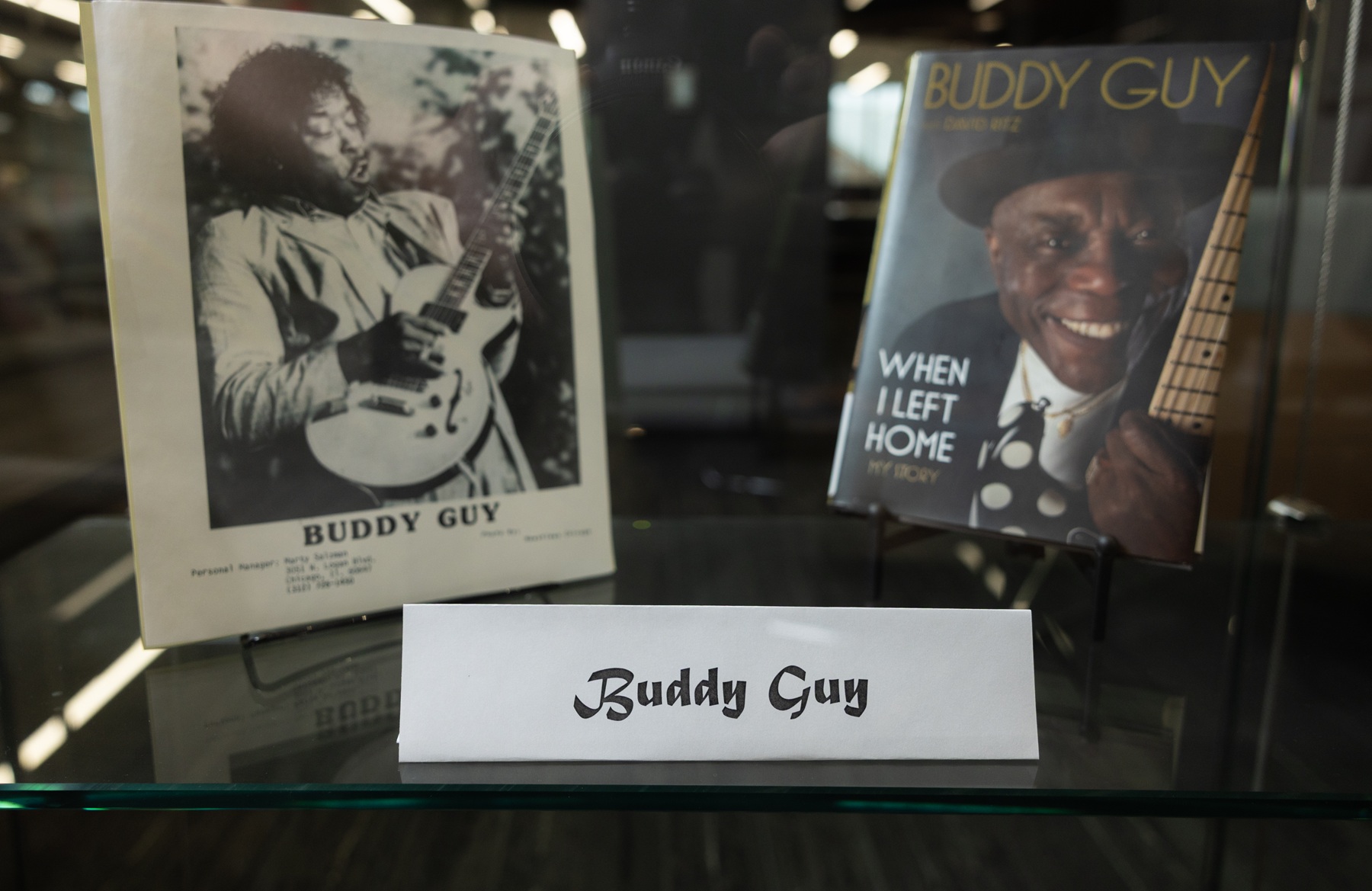 A photo of Buddy Guy and his autobiography are pictured in the Harper Library performance exhibit.