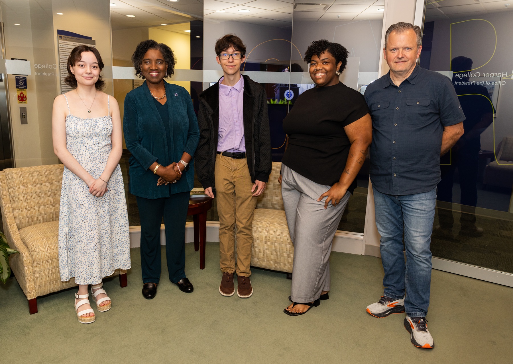 Becky Reck, Dr. Avis Proctor, Otto Kowalski, Fatima Hendricks and Jason Peot stand in the Harper College president's office