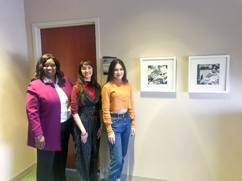 Dr. Proctor, Stella Gurevich and Anhelina Karashevska stand next to their newsly installed artwork