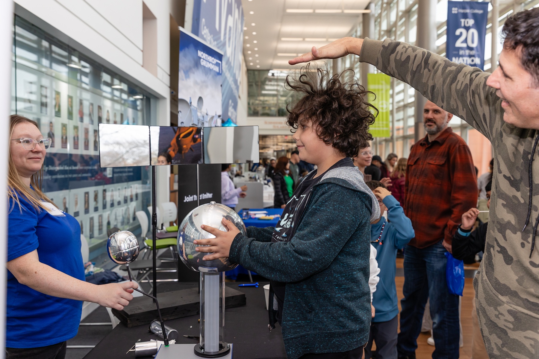 A boy experiences a science demonstration on Harper College's campus