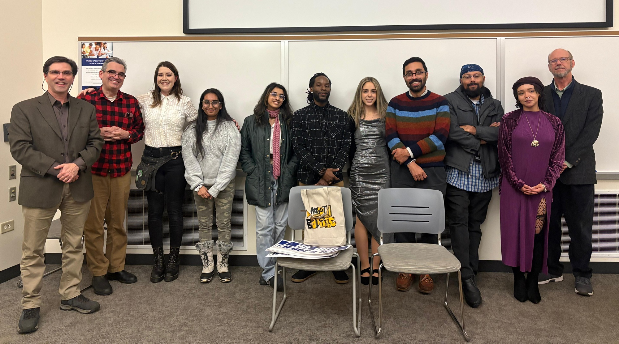Harper College faculty and students pose for a photo following the Social Transformation Capstone Showcase in December 2025.