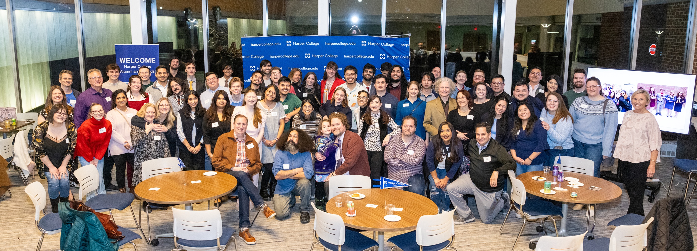 Harper Speech and Debate Team alumni pose for a group photo in Building D