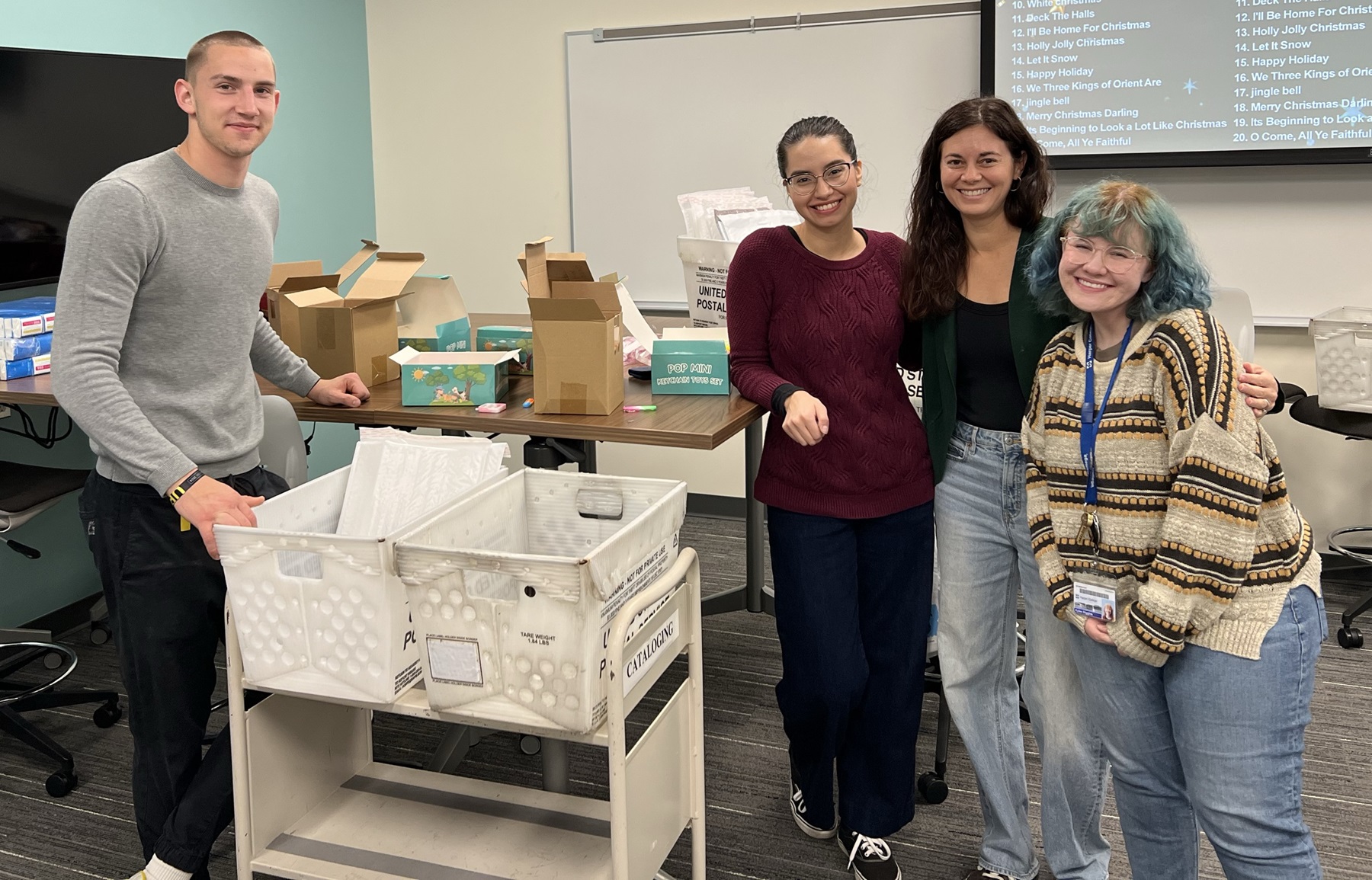 Maksym Perchyts, Ailyn Trujillo, Kristin Allen and Kylee Higgins pack thrive kits.