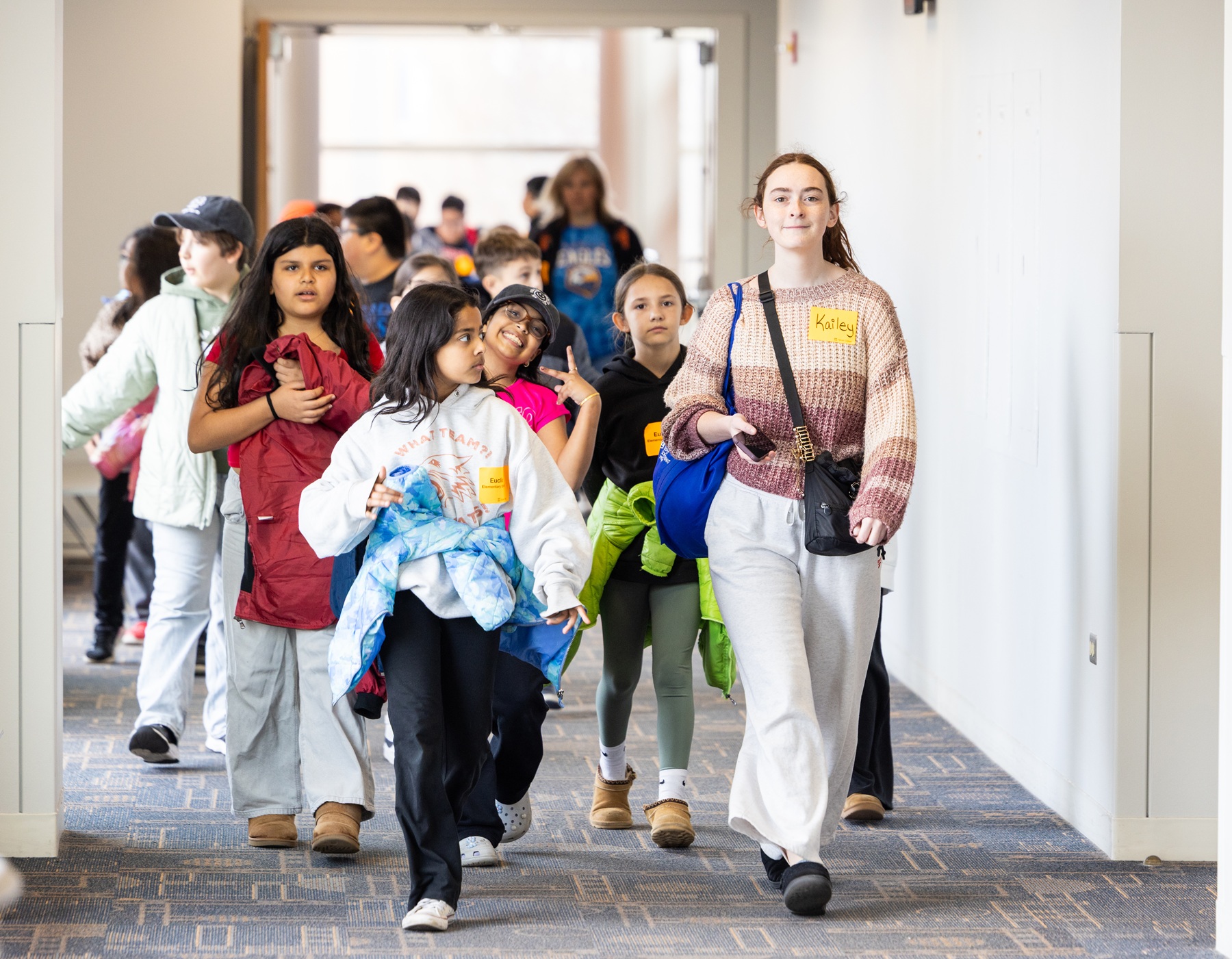 Harper student Kailey Sohn leads a fourth-grade class around campus