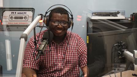A Harper DJ on the air in the WHCM radio booth