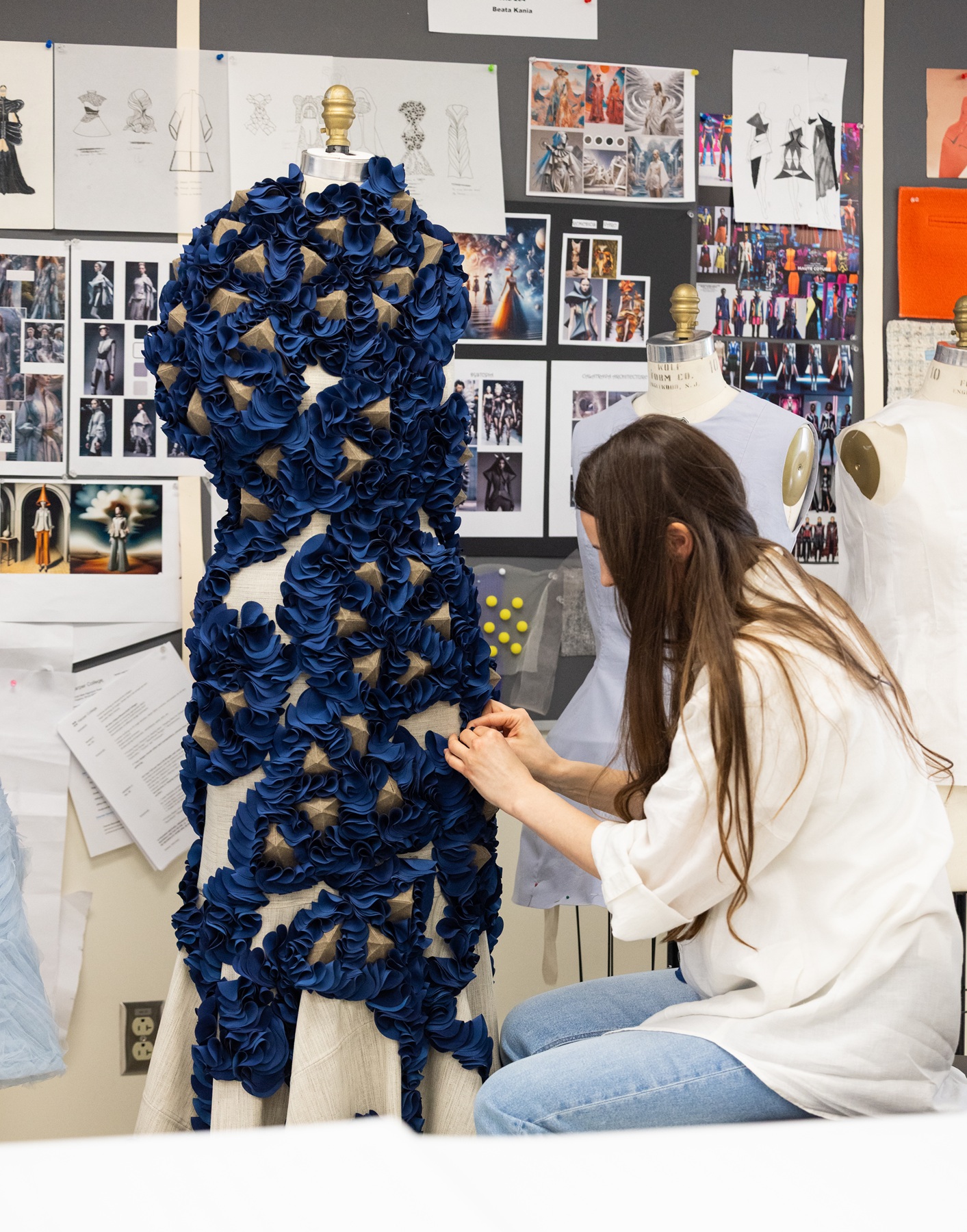 Katsiaryna Piatsevich works on her garment