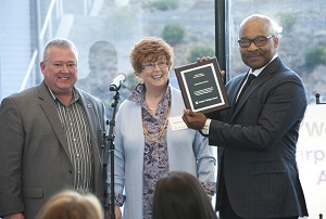 Brian Little of Zurich North America accepts a plaque