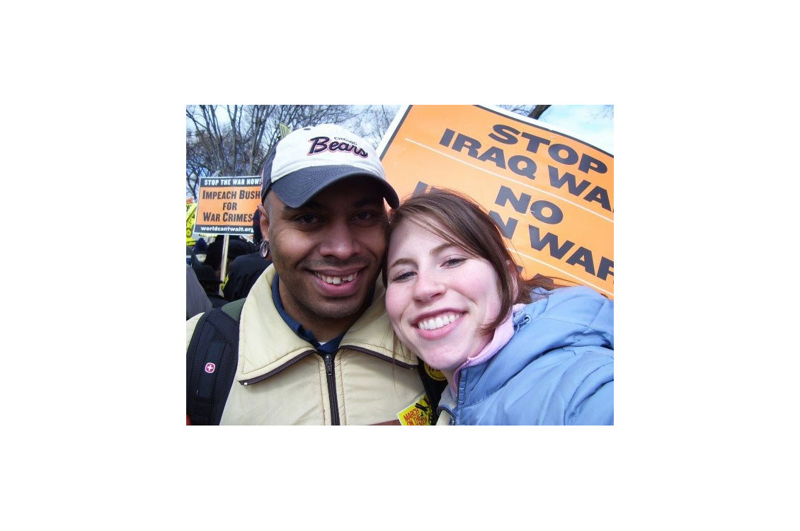 Harty and his wife smiling at an anti-war protest
