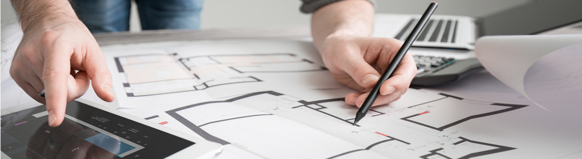 Architectural studies professionals drafting a room's layout.