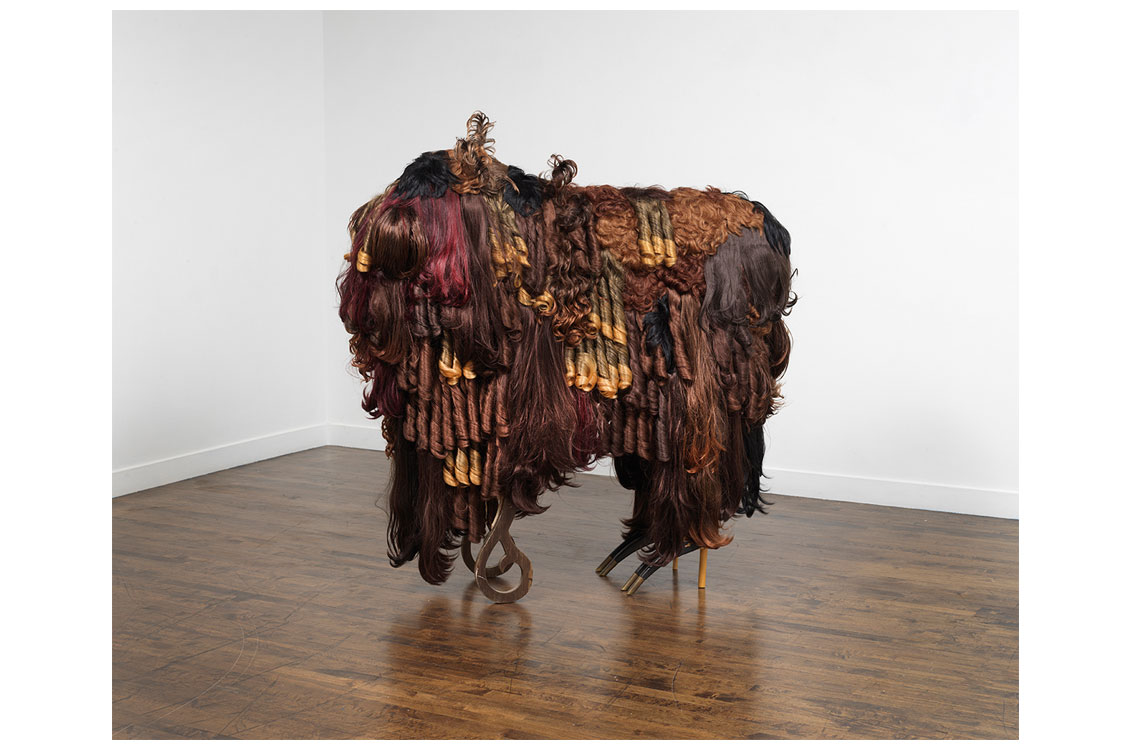 large sculpture made of synthetic hair in the shape of a buffalo