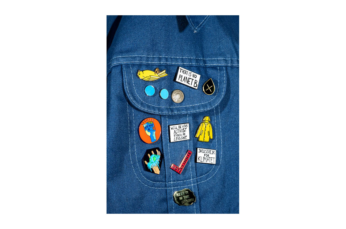 jean jacket with enamel pins attached