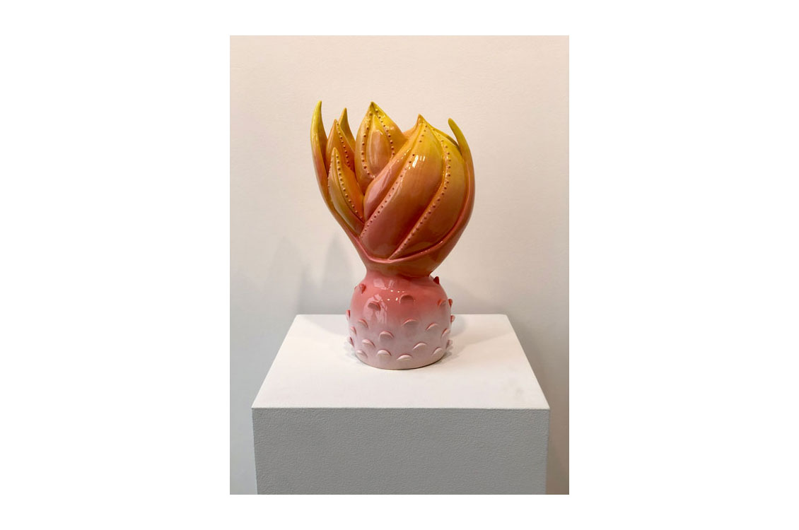 orange and pink plant shaped ceramic sculpture