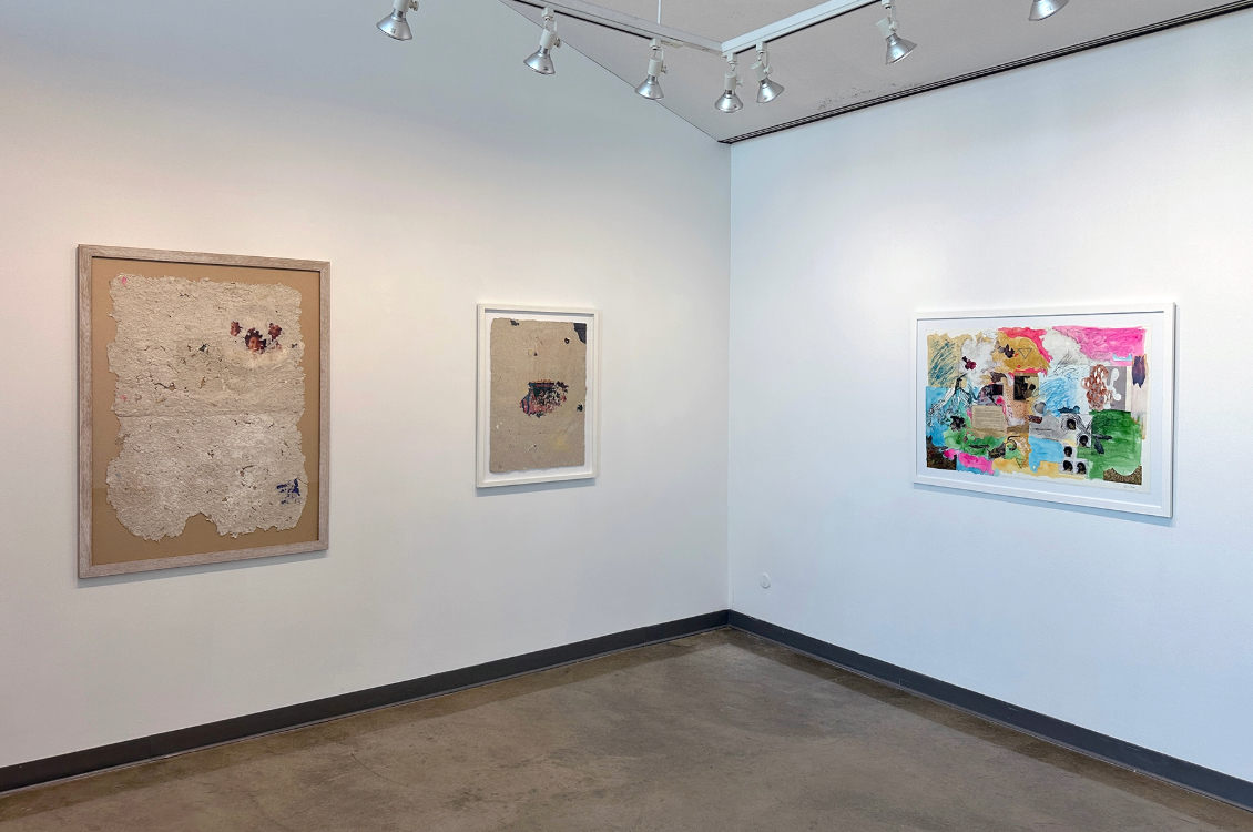 installation view of the exhibition space with artworks displayed on the walls