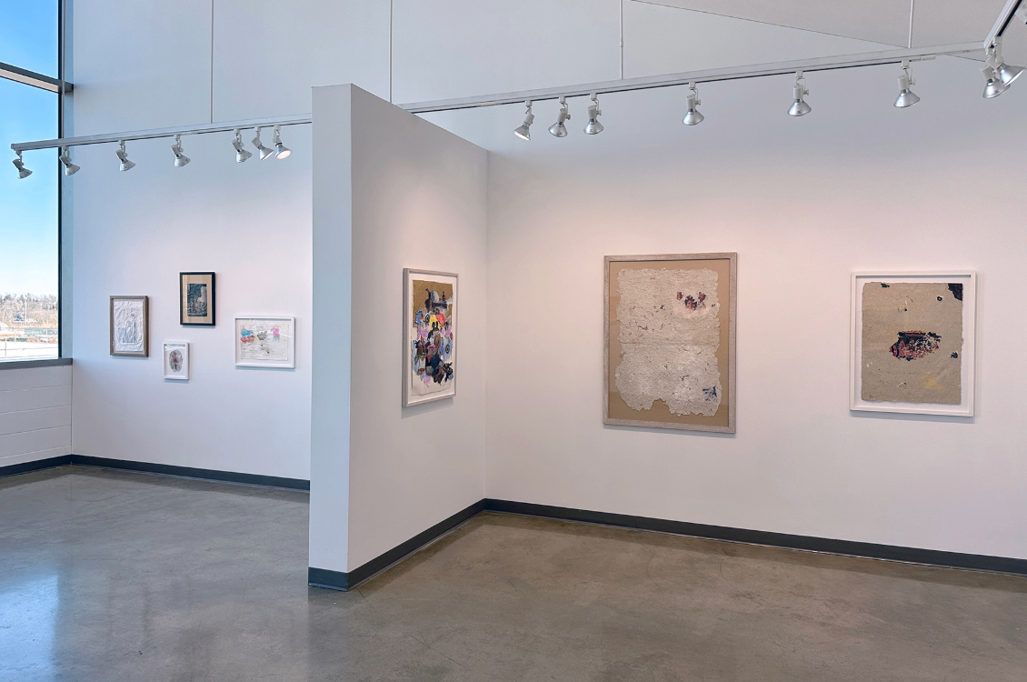 installation view of the exhibition space with artworks displayed on the walls