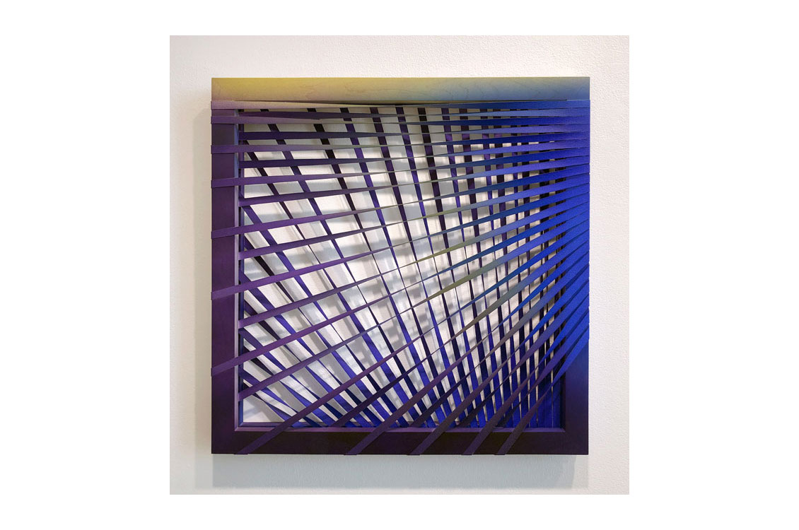 Purple and blue strips of canvas woven together narrowly on one end and widely on the other 