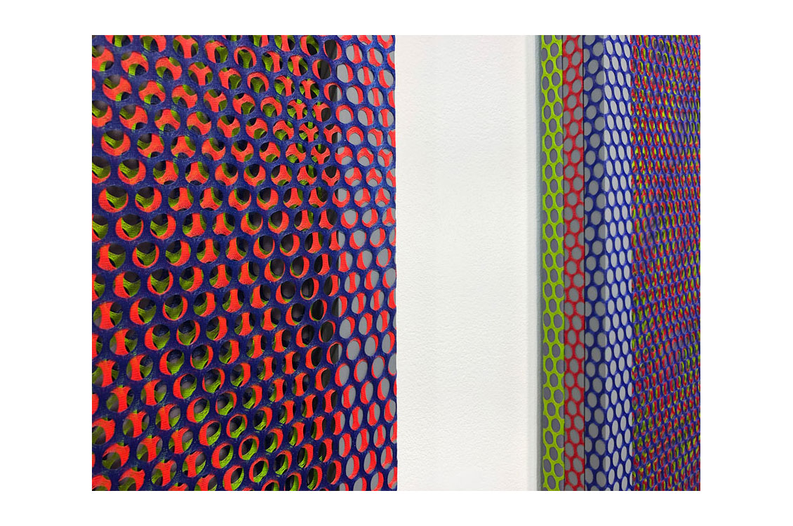 close up of canvases with different colored screens overlaying them