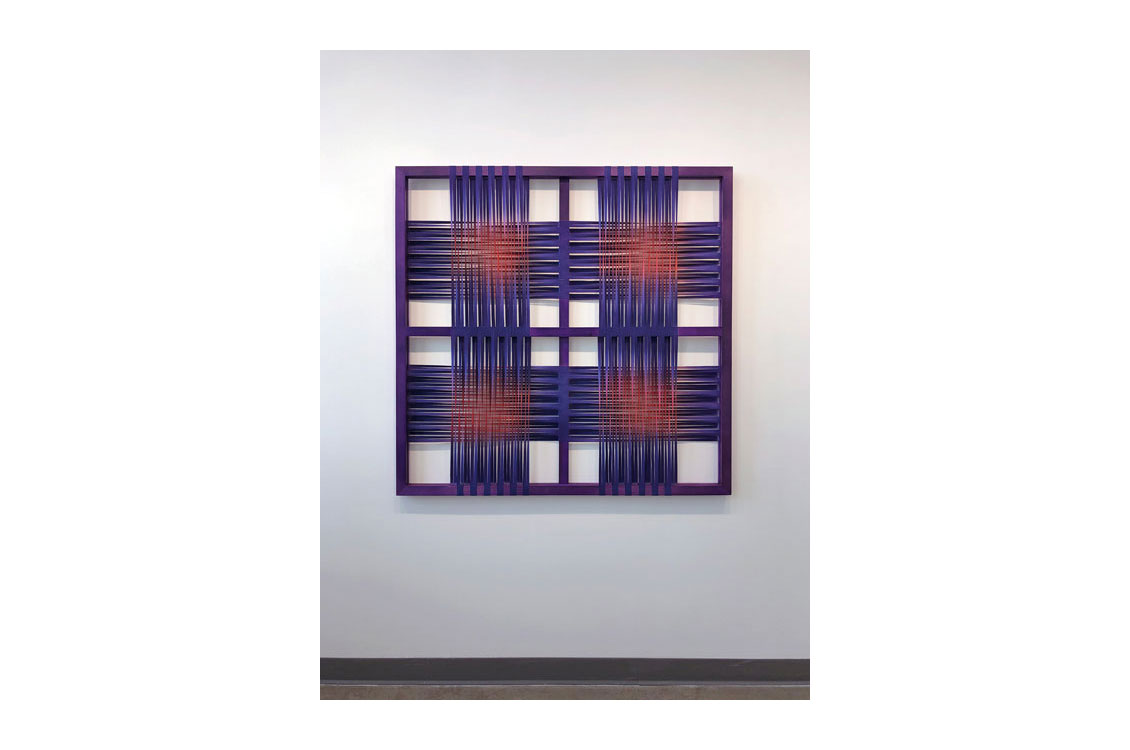 canvas divided into four panels, each one with blue and orange strips of canvas woven in a cross pattern
