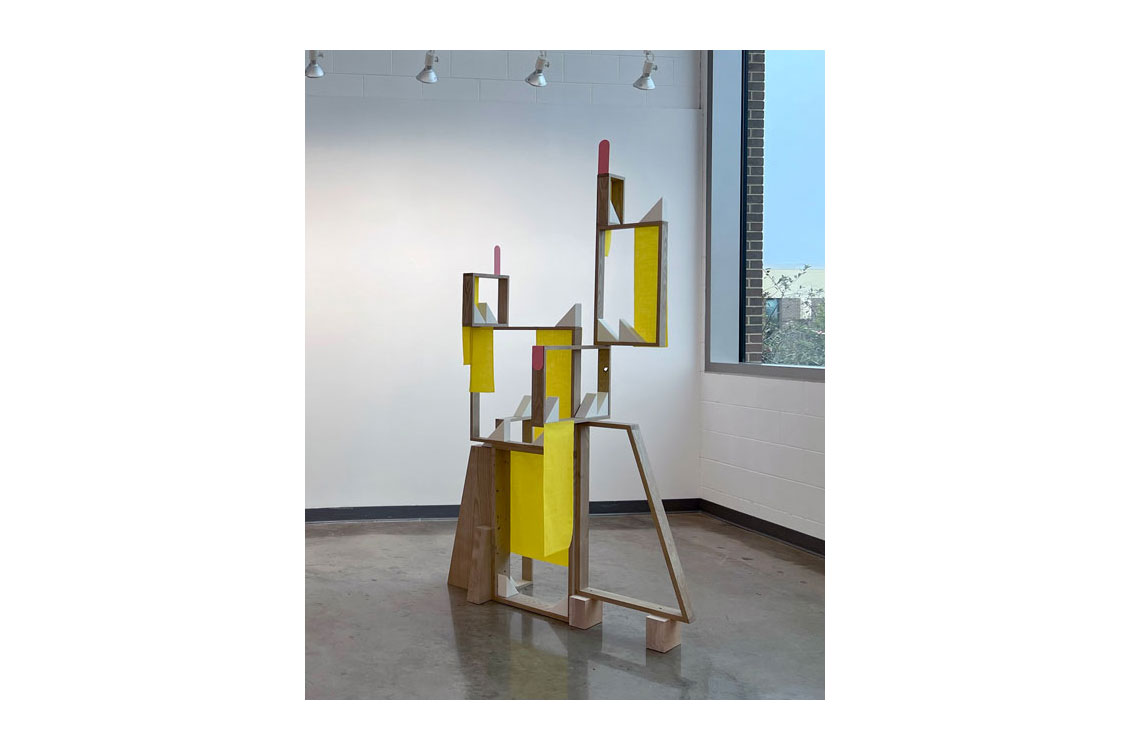 large, free standing sculpture, geometrical wood frames with yellow panels