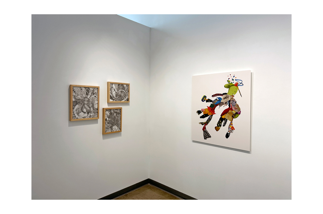 view of gallery corner with black and white drawings on left and color painting on right