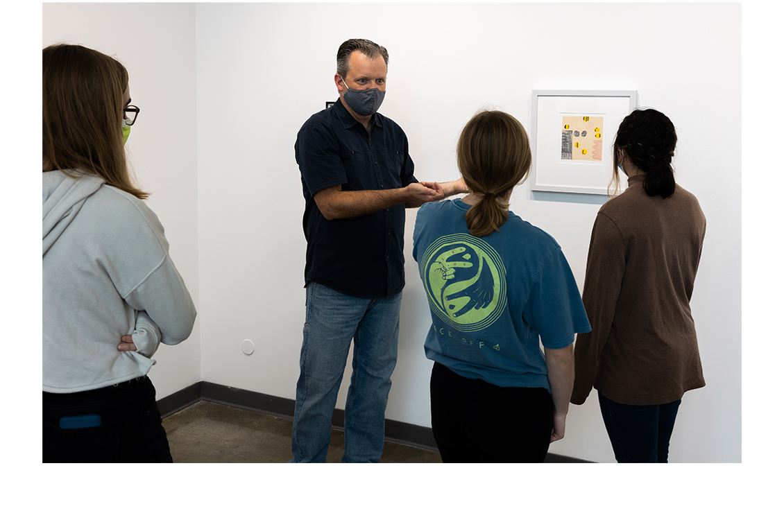 Students view works in the exhibition space