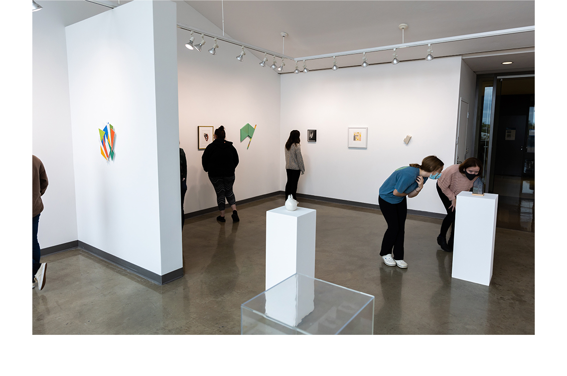 Students view works in the exhibition space