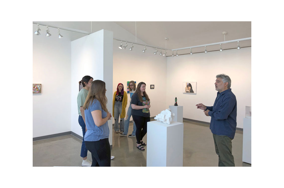 students on a tour in the gallery viewing Cluster