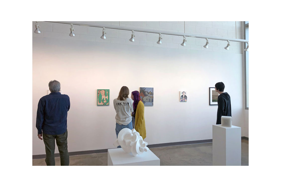 students view artwork in the Small Works 2022 exhibition