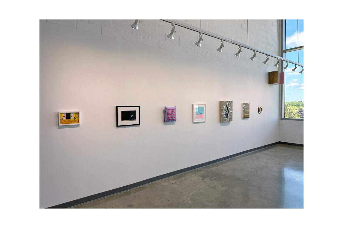 installation view of Small Works gallery focused on paintings hung on wall