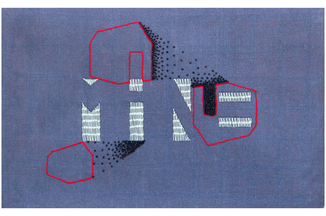 Blue fabric with red-outlined geometric shapes filled with white and black stitching in a decorative pattern.