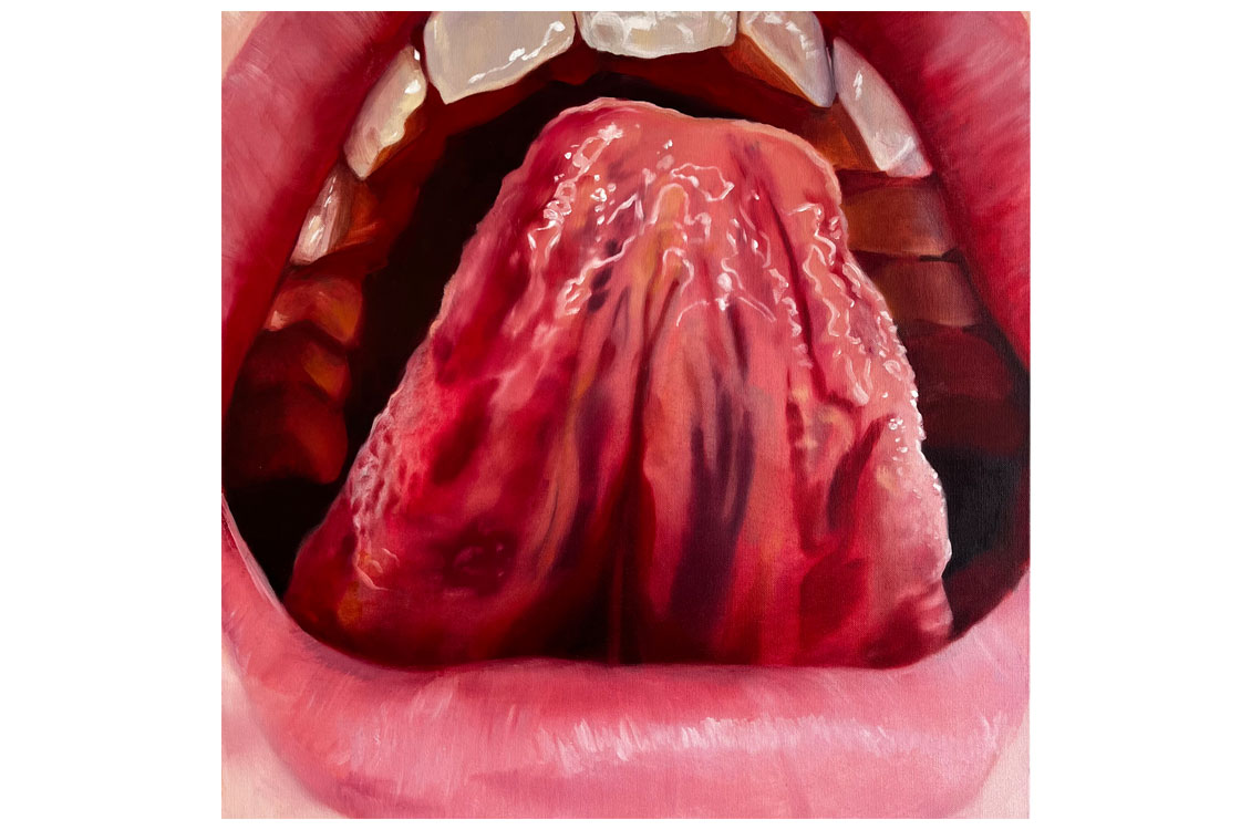 Close-up of an open mouth showing textured tongue, upper teeth, and lips framing the image.