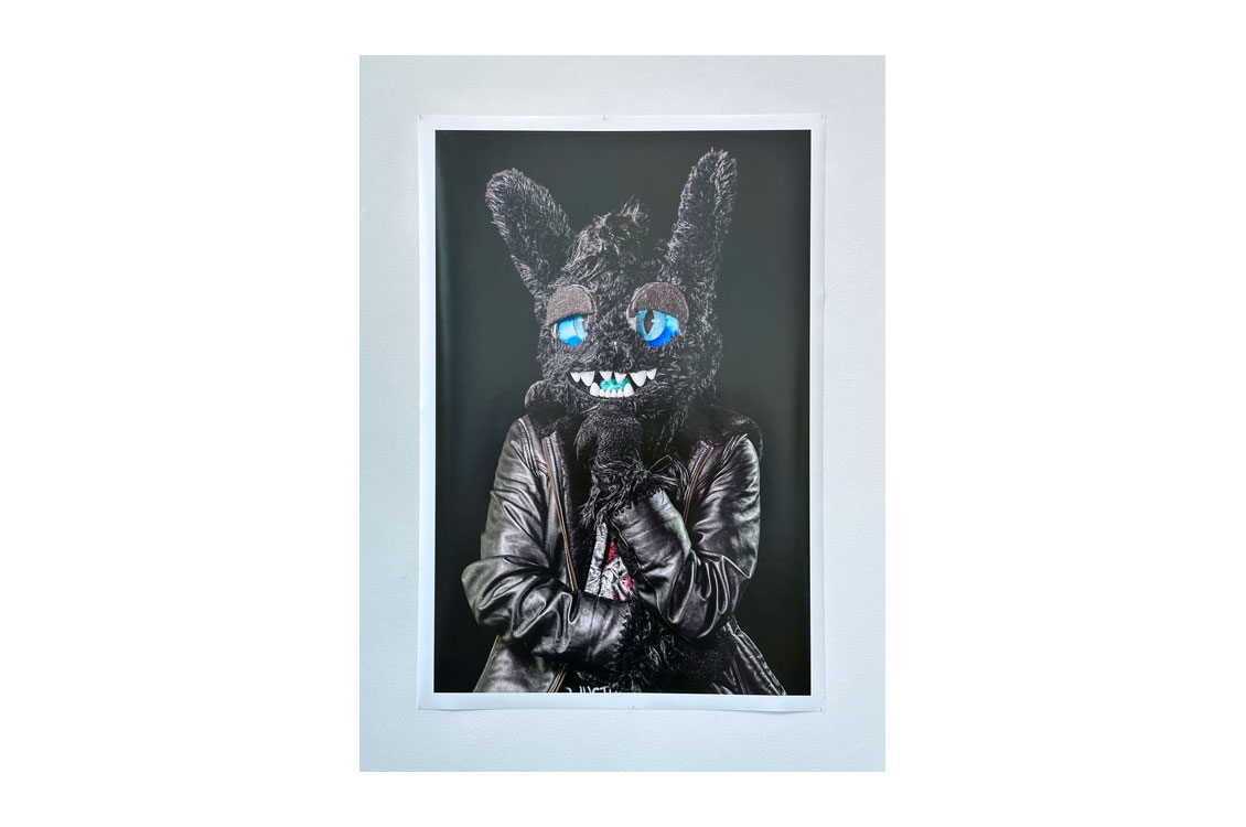 photograph of a man in a black rabbit suit