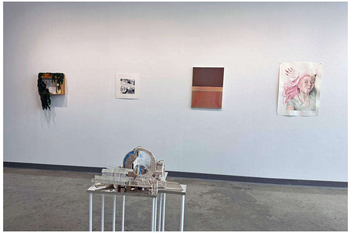 interior gallery view of paintings on walls