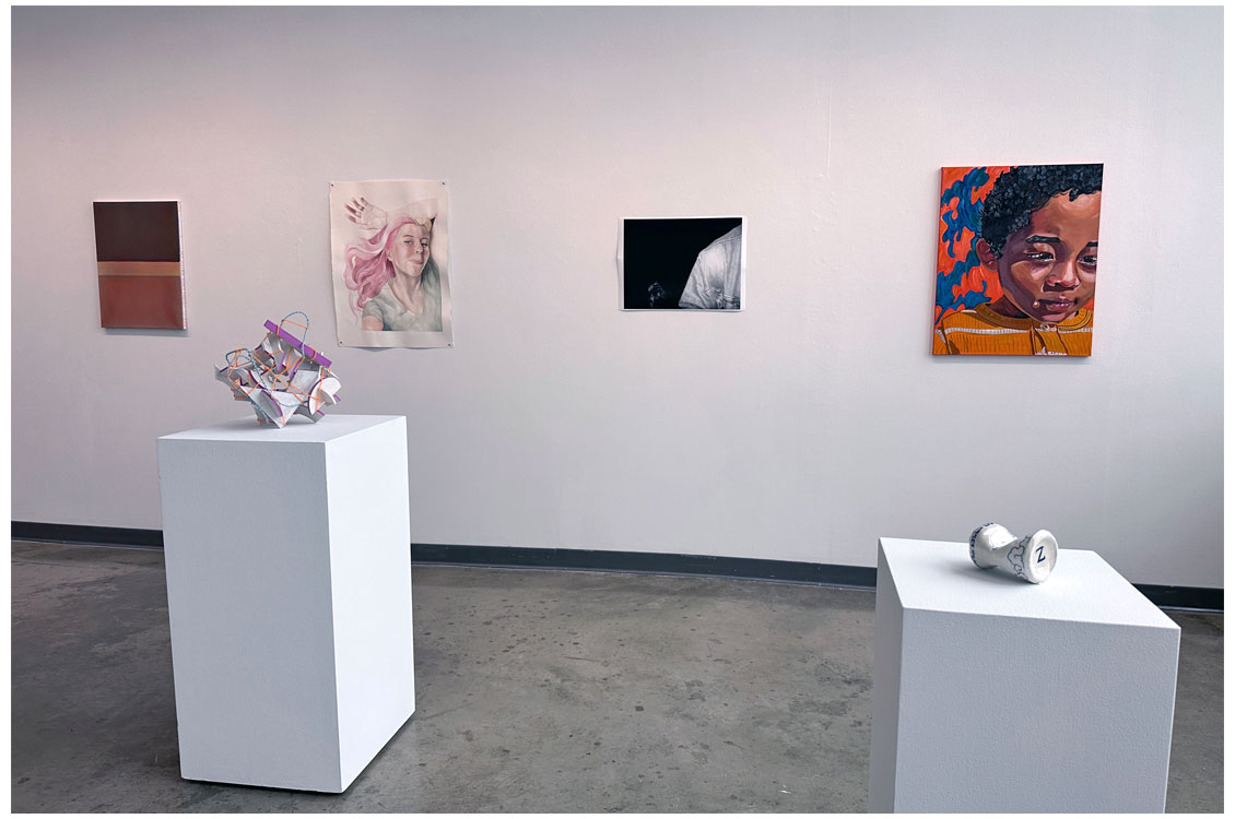 interior gallery view with sculpture of can
