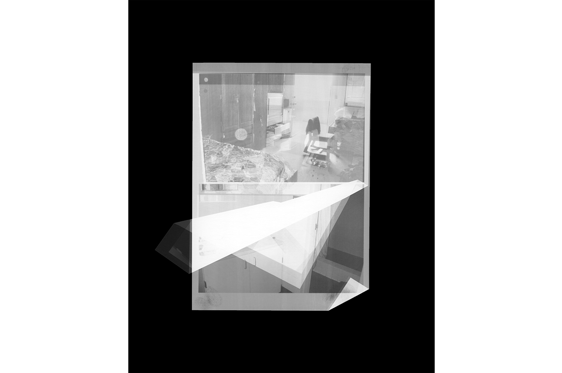 Distorted polaroid of a kitchen in black and white.