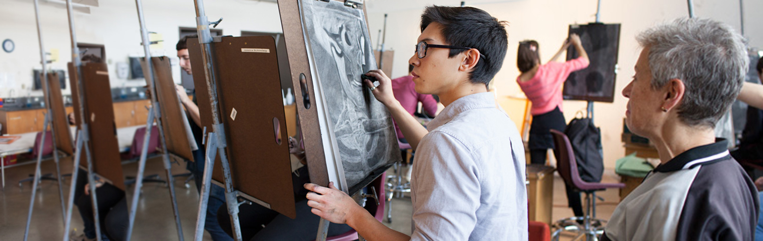 Student painting on canvas