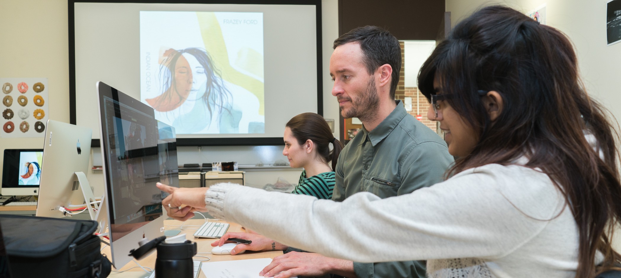 Student showing professor digital artwork