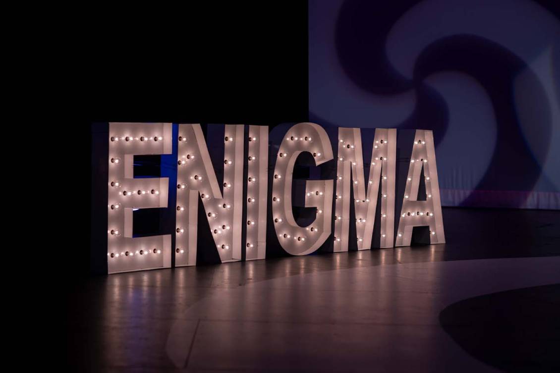 Lit up Enigma sign on stage