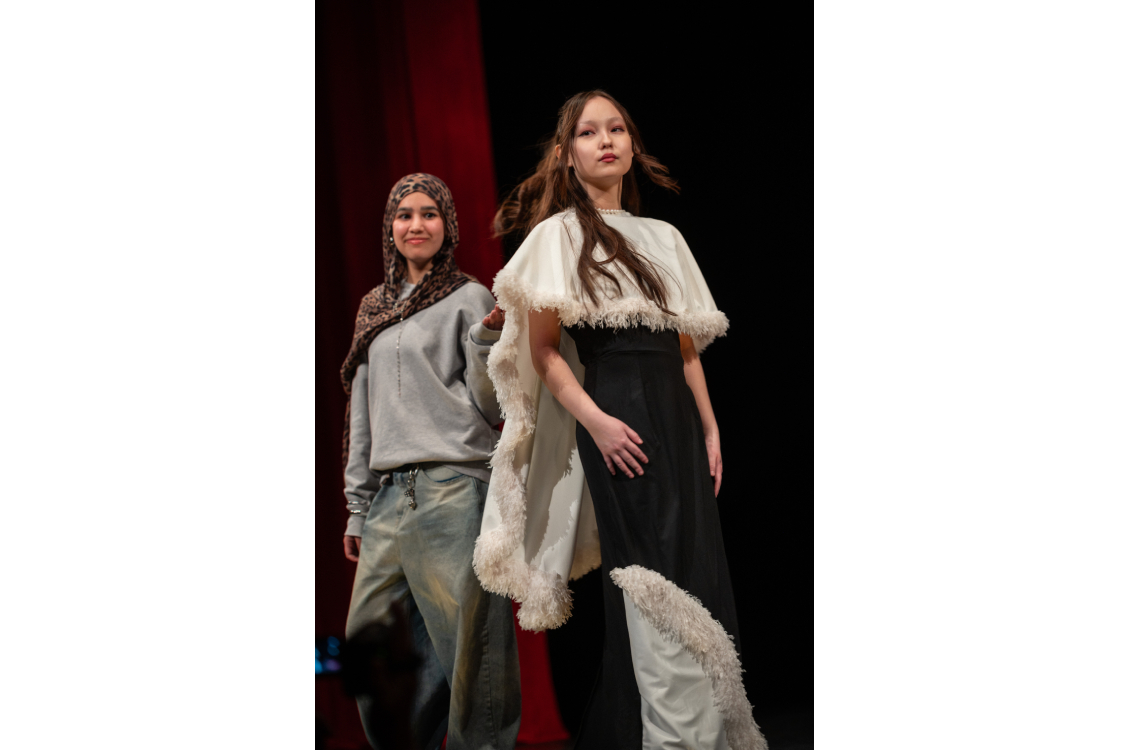 two models walking on runway