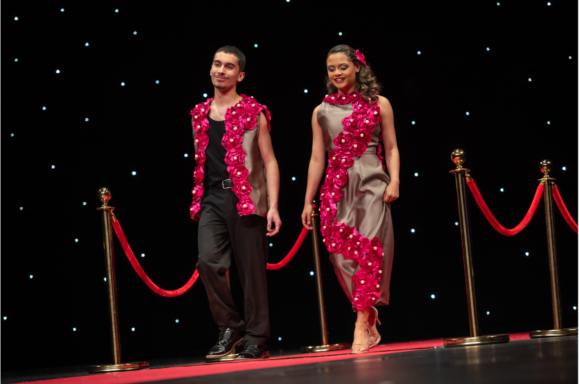 female and male matching flower outfit models on the runway