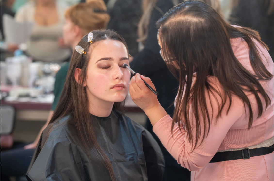 Backstage makeup on model