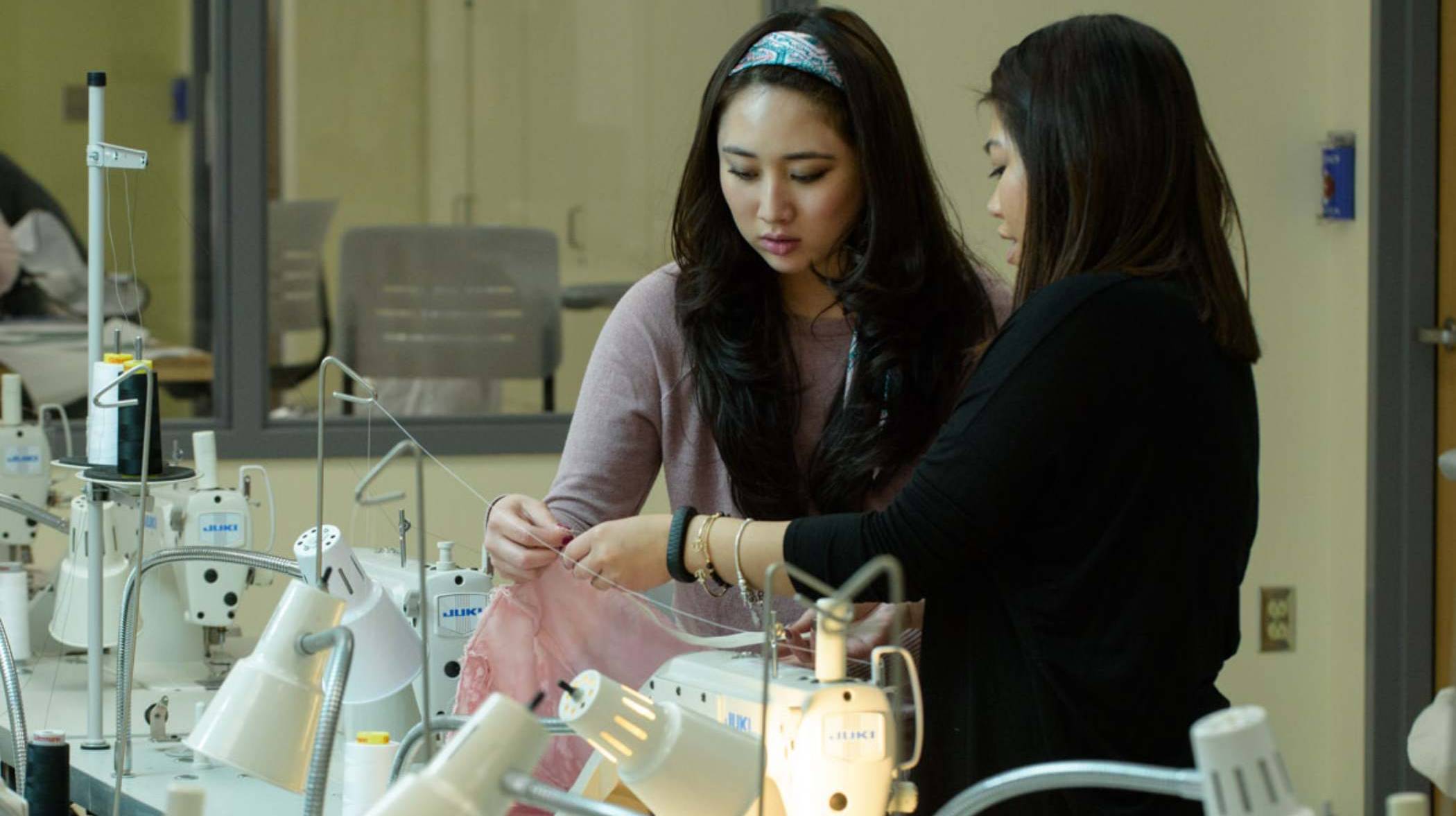 two students going over fabric selection